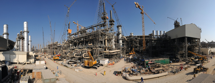 Construction site against clear blue sky